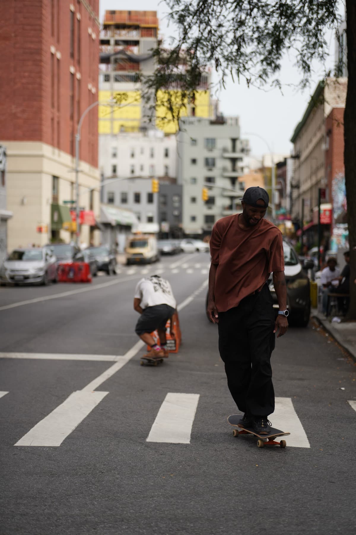 Leon Toppin giving a private skateboard lesson to an adult student