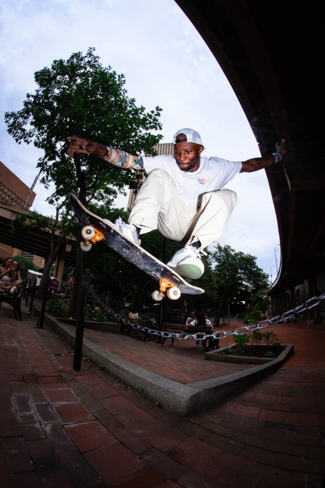 Leon Toppin skating a bowl in NYC with the skyline in the background